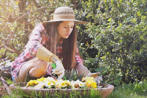 Arkley gardener using sustainable gardening tools