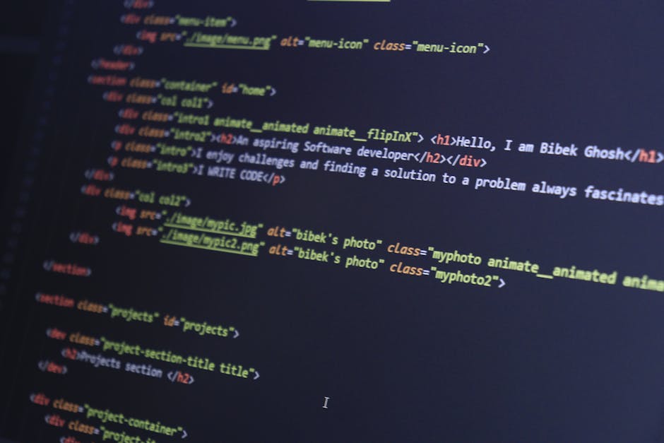 A close-up photograph of a computer monitor displaying lines of HTML code in various colors, including blue, orange, yellow, and white. The code includes tags such as <h1>, <div>, and <img>, with refe